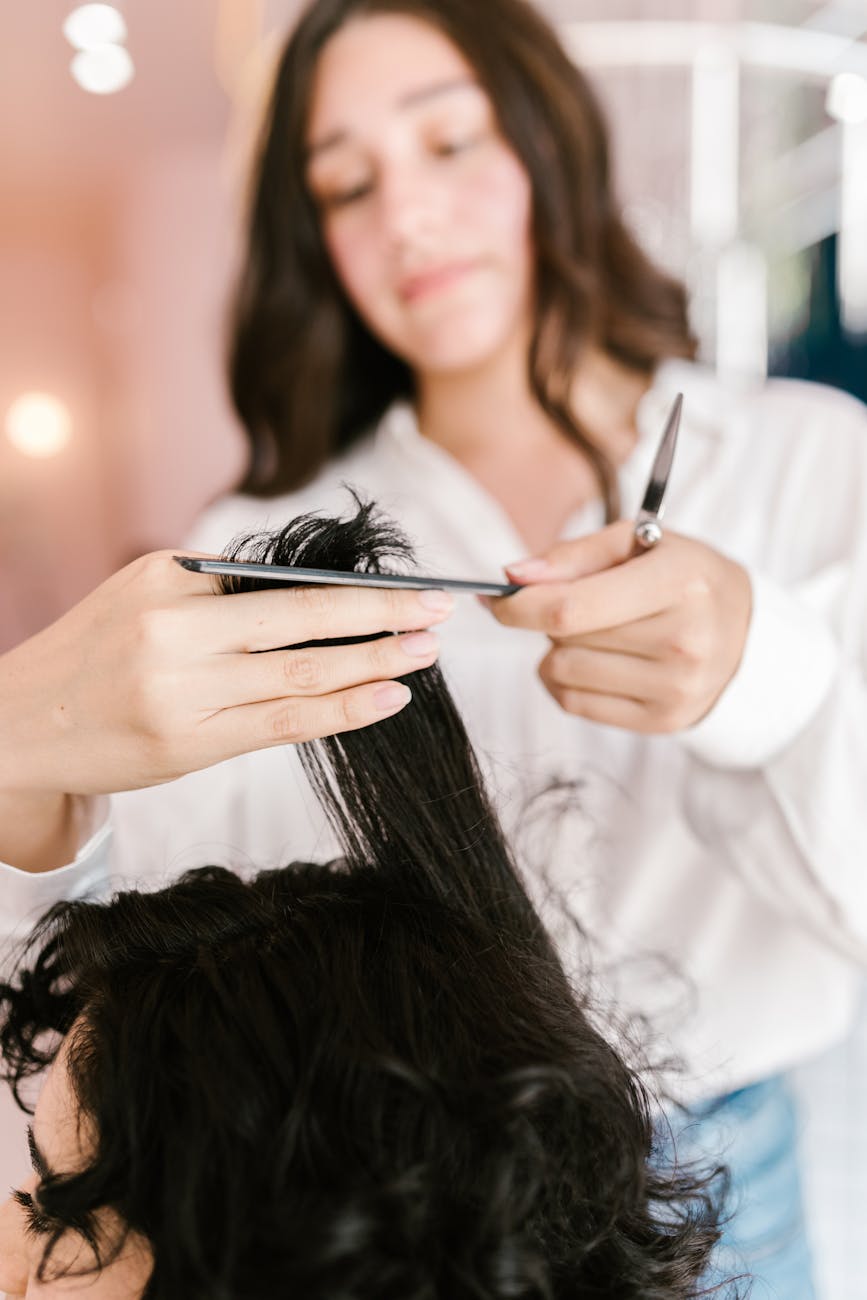 Beauty stylist working a client